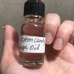 Massage oil, bath oil and hair taming frizz serum